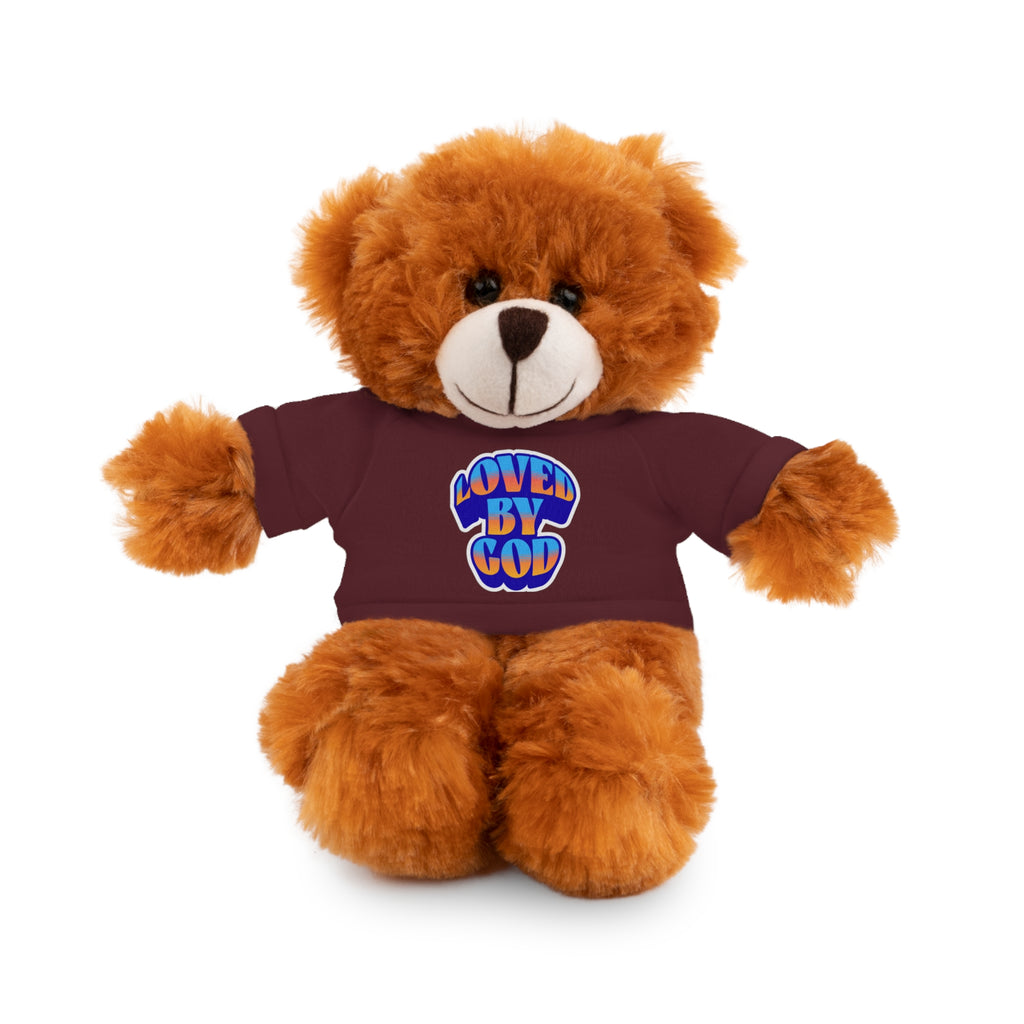 Brown teddy bear wearing a maroon shirt with colorful "Loved by God" text sitting on white background