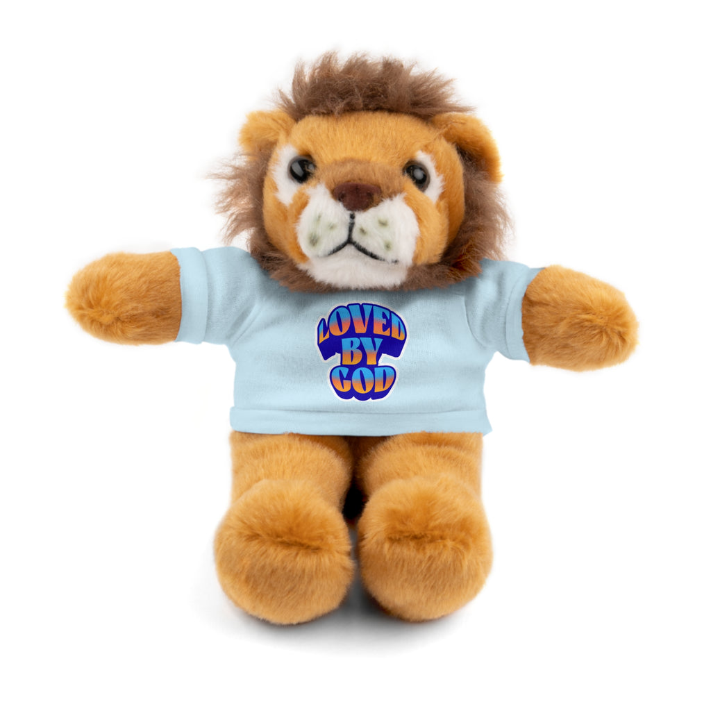 Plush lion toy wearing a light blue shirt with colorful "Loved by God" text on the front sitting upright on white background